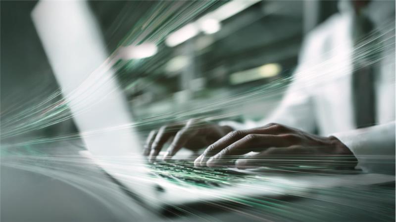 An analyst working tirelessly to ensure no alert is missed.