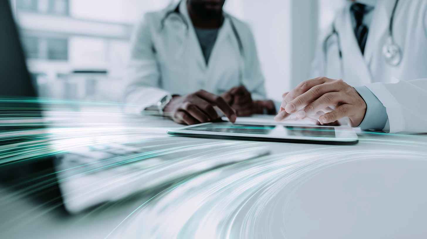 Healthcare professionals using digital healthcare technology and AI-powered security operations to protect patient data, electronic health records, and connected healthcare systems from cyber threats.